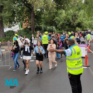 Security guards controling crowd